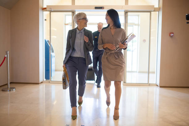 istock Businesswoman entering a hotel with her assistant 1438153063