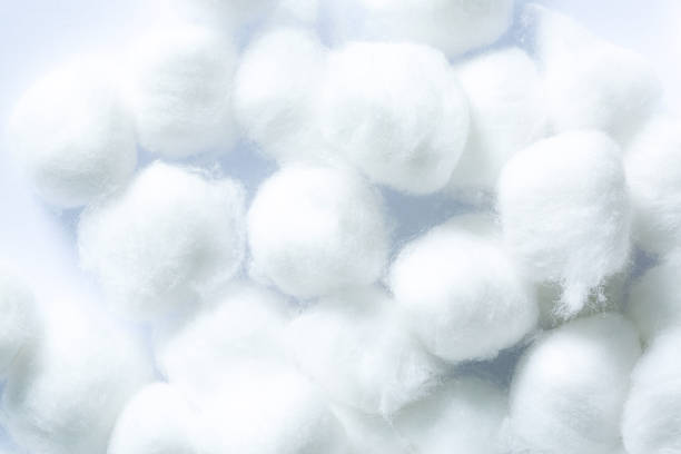 istock Fluffy white cotton flower,macro white cotton texture,Use cotton wool isolated on a white background. 1438153714