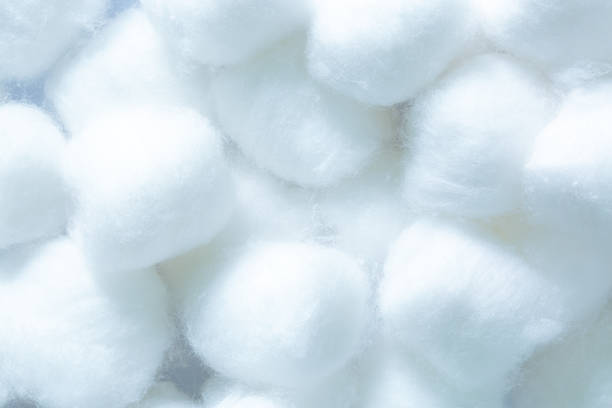 istock Fluffy white cotton flower,macro white cotton texture,Use cotton wool isolated on a white background. 1438153715