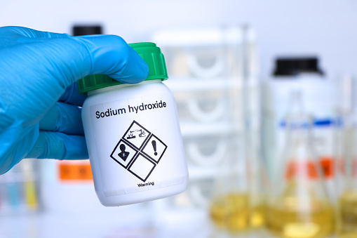 Sodium hydroxide in glass, chemical in the laboratory and industry