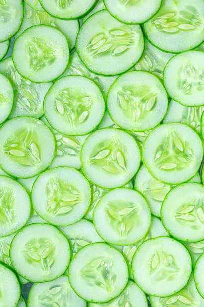 istock Macro Cucumber,Fresh cucumber slices background,Fresh slice cucumber on white background 1438154141