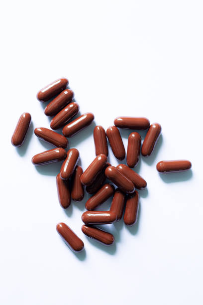 istock Brown capsule pill on a white background,brown capsule pill on a white background 1438154151