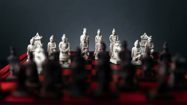 istock Selective focus of vintage Chinese Terracotta figurines on a chessboard 1438155480