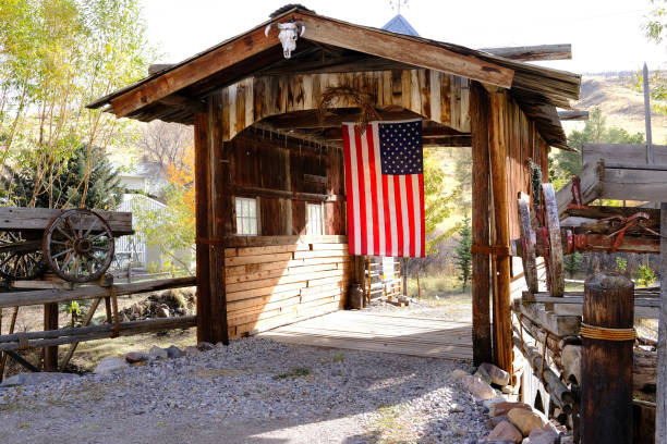 istock Old Covered Wooden Bridge with American Flag 1438155720
