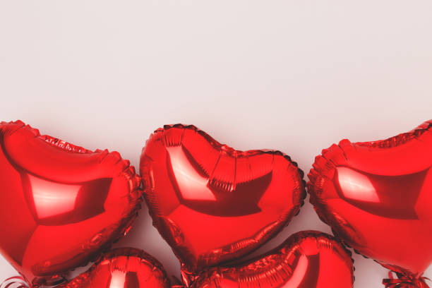 istock Red inflatable foil balloons in a heart shape. 1438157761