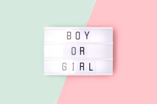 istock Boy or girl. Lightbox with letters on a pink and blue background. 1438157762