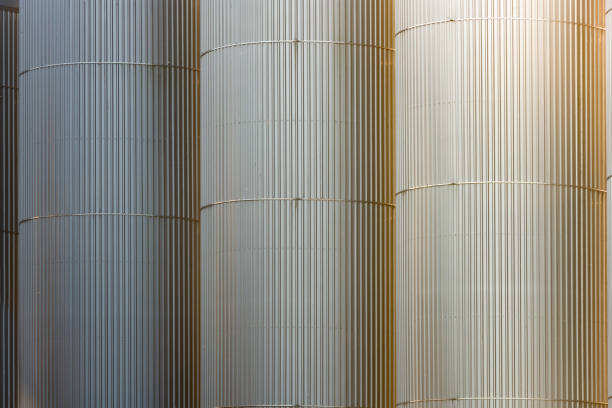 Industrial storage tanks close up creating an abstract line pattern and shape.