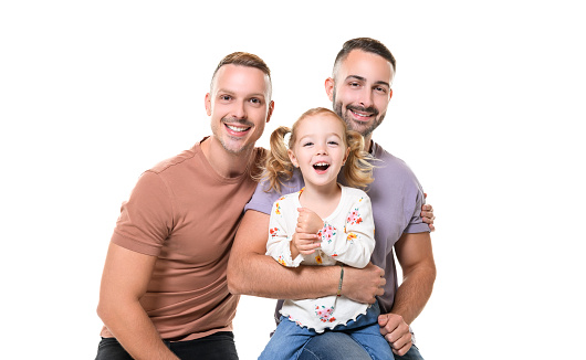 A Two man couple with adopted child girl on white background