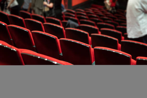 istock people taking seats before theater play 1438158202