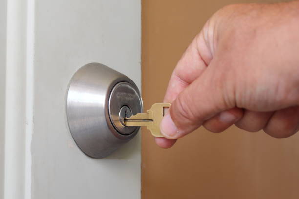 istock A person puts a key in a lock 1438158792