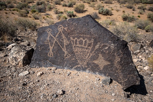 A closeup of an ancient petroglyph at Boca Negra Canyon in New Mexico