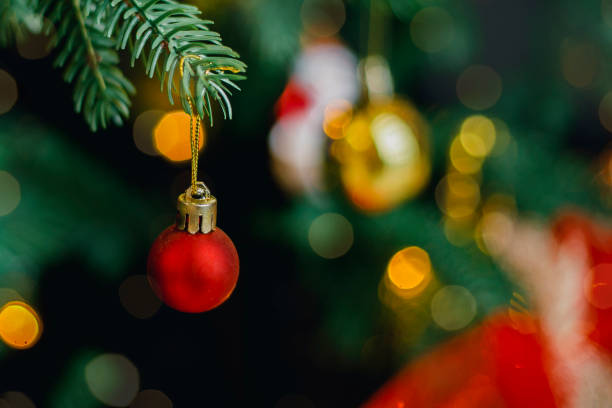 istock Red and silver decoration on Christmas tree at home interior. Holiday background with bokeh lights. Christmas and New Year background. 1438159669