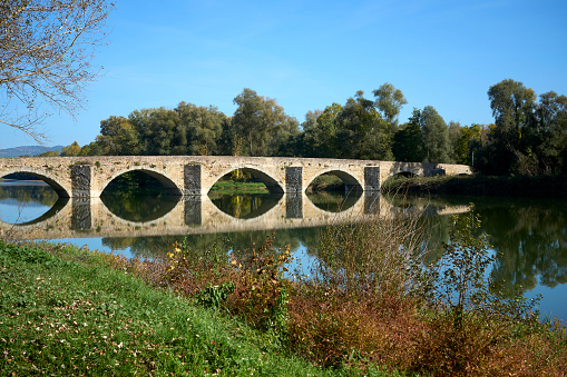 famous bridge of Ponte Buriano, crossing River Arno near Arezzo, Tuscany, Italy