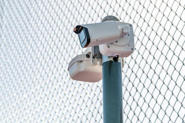 istock CCTV security camera in front of the restricted area surrounded by wire mesh 1438163433