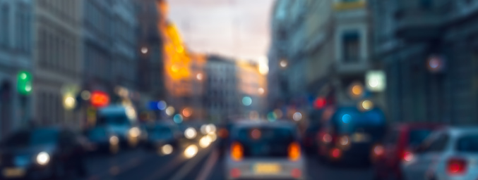 A blurred car crossing a road intersection in New York. Panning effect.