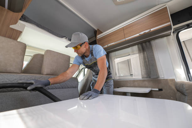 istock RV Rental Worker Vacuuming a Camper Van 1438168277