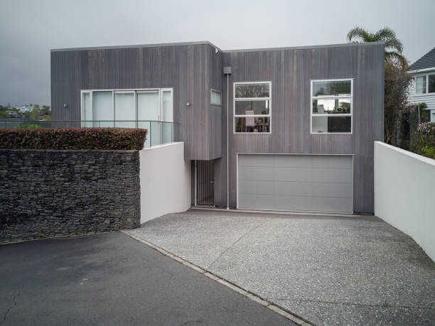Auckland, New Zealand – October 11, 2019: View of gray modern suburban house in Howick