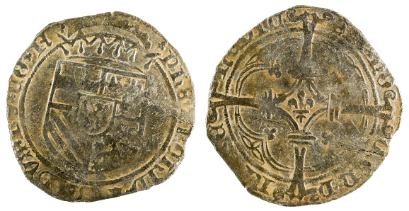 A closeup of an ancient coin of King Felipe I.