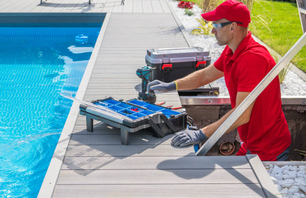 Outdoor Pool Maintenance Service Worker stock photo