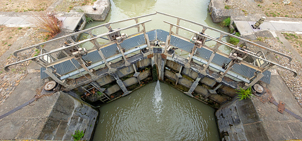 Closed gates of a ship lock in the Canal du Midi in the centre of downstown Carcassonne.