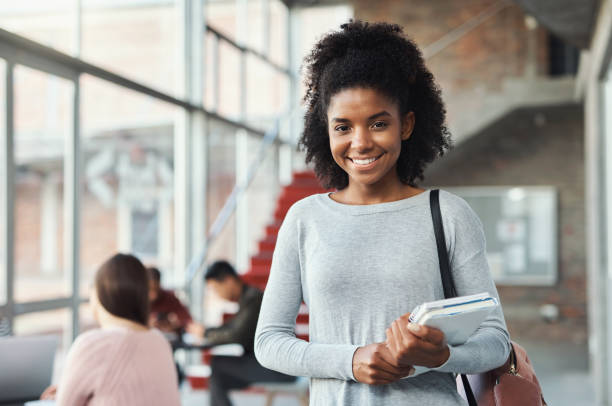 istock Education, notebook and university portrait of student with books for learning, academy study or college studying. Knowledge, scholarship and gen z black woman at school campus for English exam test 1438172977