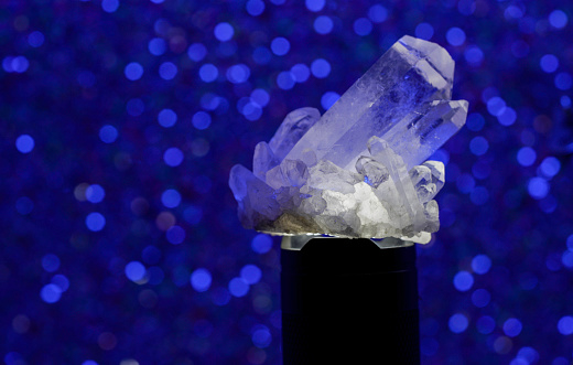 Quartz with mineral crystals photographed in the studio against a black background