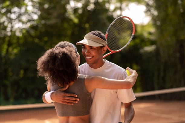 istock Smiling young man hugging his game opponennt after the game 1438174031
