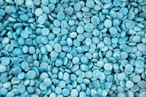 istock Full frame of Blue Turquoise glass gemstone particles. Decorative Stone pebbles for coating in the Aquarium or garden. Extreme close up of heap, top view 1438174600