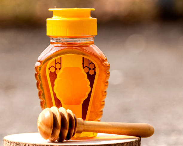 istock honey in a plastic bottle with a blur background 1438175695