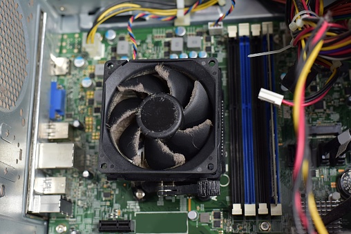 Dust on CPU cooling fan inside of a PC computer