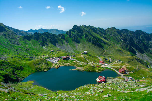 Lake Balea in the Fagaras Mountains, seen from above balea, Romania – August 17, 2020: Lake Balea in the Fagaras Mountains - Romania, seen from above balea lake romania stock pictures, royalty-free photos & images