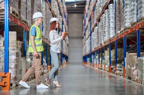 istock Warehouse employee and an inspector conducting a racking system inspection 1438177799