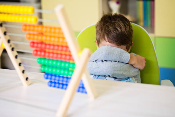 istock Angry Caucasian toddler boy making a tantrum and refusing to play with an abacus 1438179353