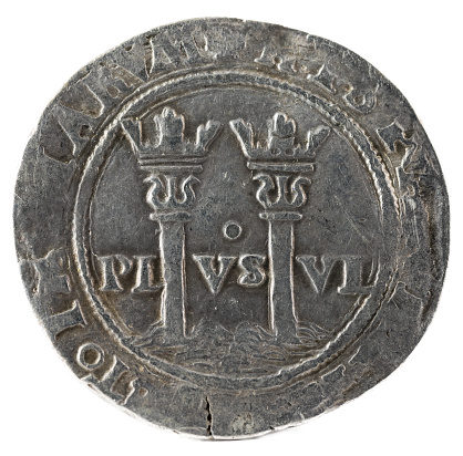 An ancient Spanish silver coin of the Kings Juana and Carlos. Coined in Mexico. Real. Reverse.