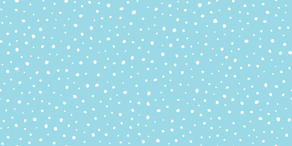 Hand drawn falling snow seamless pattern, uneven round fading chaotic dots, spots, flakes. Sketched white snowflakes on sky blue repeating snowfall background. Abstract endless texture for christmas greeting card, prints, wrapping, textile, app, web.