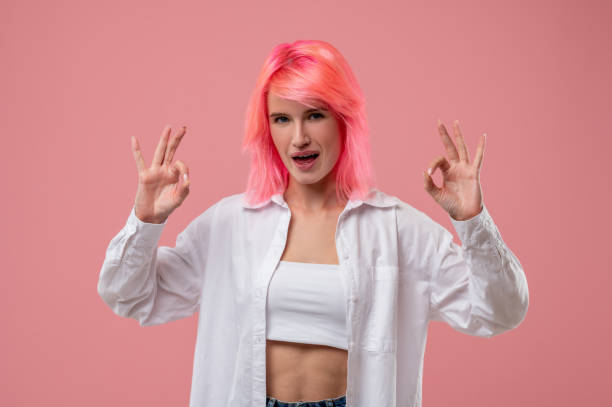 istock Determined female showing a ring gesture before the camera 1438182037