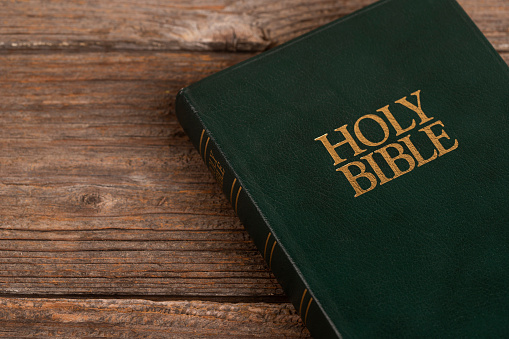 Holy Bible on wooden background