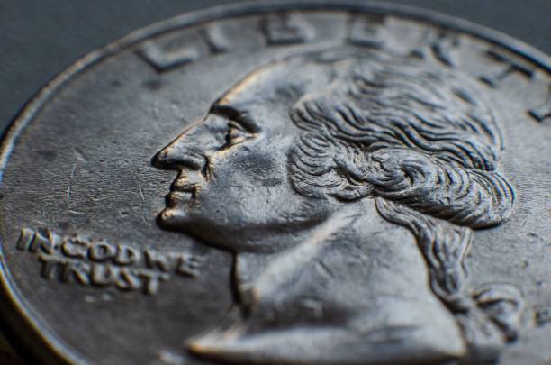 istock Closeup shot of silver liberty coin isolated on a gray background 1438184607