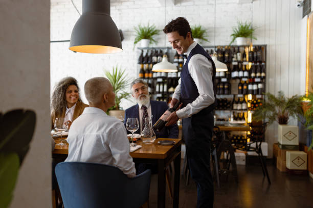Business people at Luxury Business Dining restaurant Business people having meeting at Luxury Business Dining restaurant. Vegan food served waiter stock pictures, royalty-free photos & images