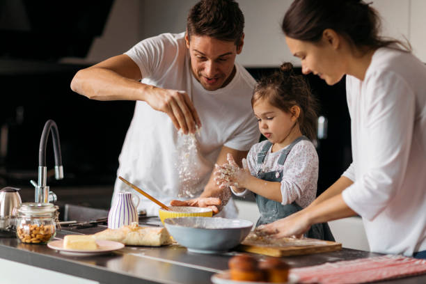 istock family having fun in the kitchen 1438185795