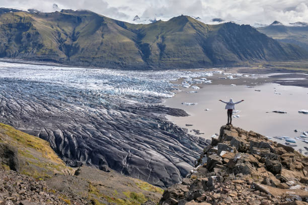 Majestic glacier Vatnajokull in iceland, tourist girl reached the top stock photo