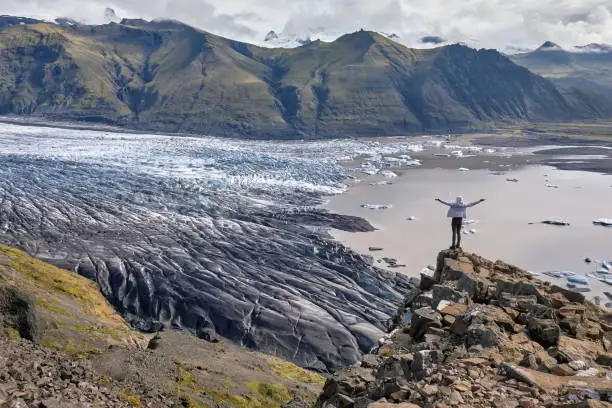 Majestic glacier Vatnajokull in iceland, tourist girl reached the top