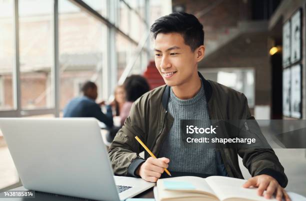 College Student Asian Man And Studying On Laptop At Campus Research And Education Test Exam Books And Course Project Happy Japanese University Student Knowledge And Learning Online Technology Stock Photo - Download Image Now