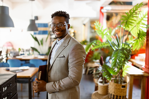 Portrait of a black businessman in a luxury restaurant