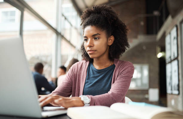 Student education, laptop and black woman typing research assignment for university, college or school study project. Learning, scholarship and African girl writing story for USA Black History Month Student education, laptop and black woman typing research assignment for university, college or school study project. Learning, scholarship and African girl writing story for USA Black History Month 21 24 months stock pictures, royalty-free photos & images