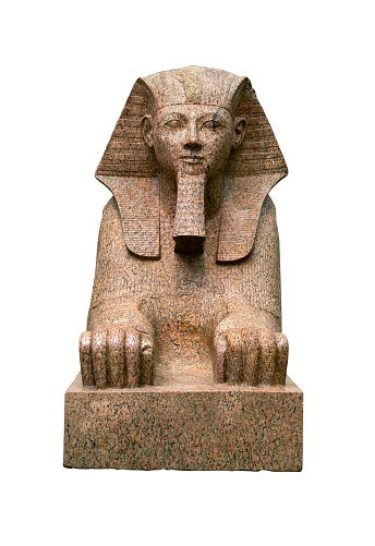 Colossal sphinx of female pharaoh Hatshepsut with the body of a lion and a human head from ancient Epypt, front view isolated on white background
