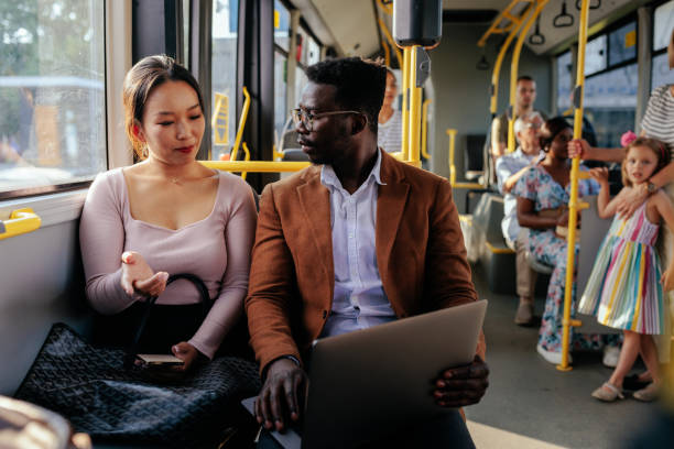 istock Young couple on a city bus 1438188555