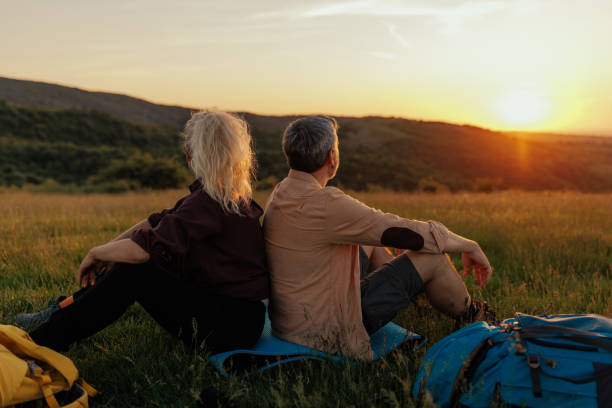 istock Husband and wife resting after hiking 1438189188