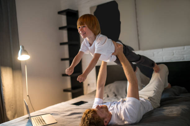 istock Cute family spending time together before bed 1438189495