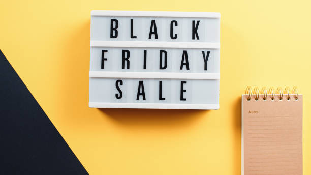 istock Black Friday sale yellow background and note 1438189865